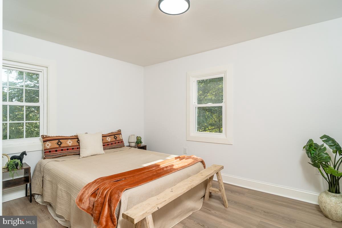 4771 Mill Creek Road Mount Jackson, VA 22842 - Photo 10 of 29 a bedroom with a bed and a potted plant