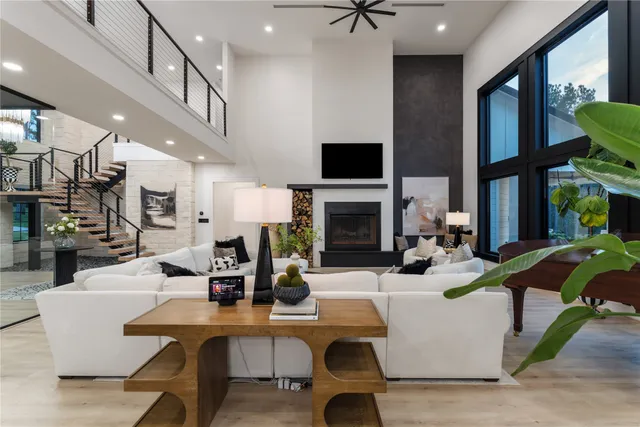 a living room with fireplace furniture and a flat screen tv