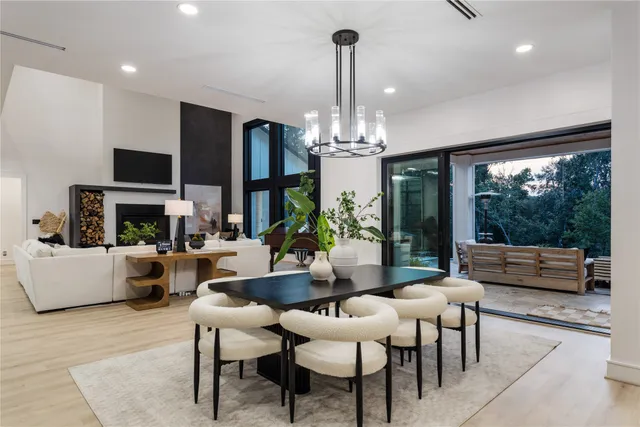 a view of a dining room with furniture wooden floor and chandelier