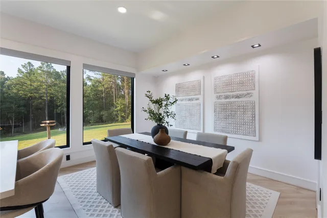 a view of a dining room with furniture window and outside view