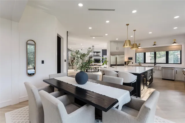 a view of a dining room with furniture and window