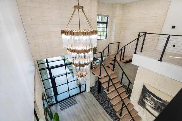 a living room with furniture potted plant and a window