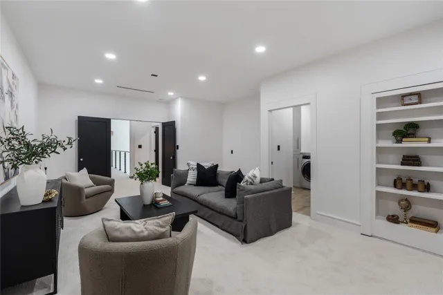 a view of a bedroom with washer and dryer