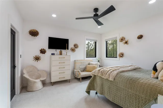 a bathroom with a sink a mirror and a toilet