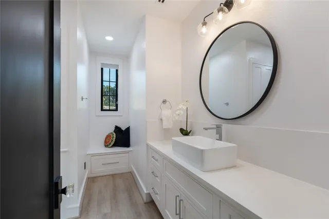 a bathroom with a double vanity sink mirror and shower