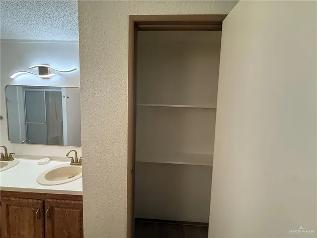 a bathroom with a sink and mirror