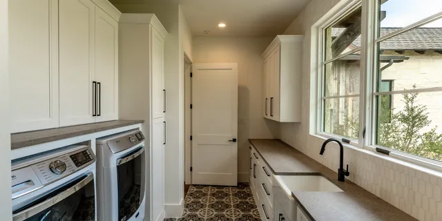 a kitchen with a refrigerator and a sink