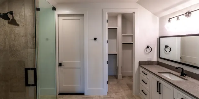 a kitchen with a refrigerator and a stove