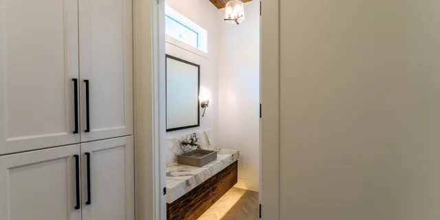 a bathroom with a sink and a mirror