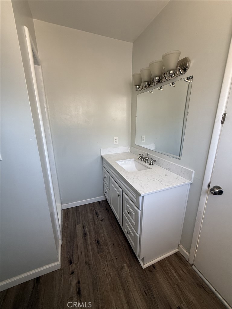 319 Elm Street Shafter, CA 93263 - Photo 13 of 14 a bathroom with a sink and a mirror