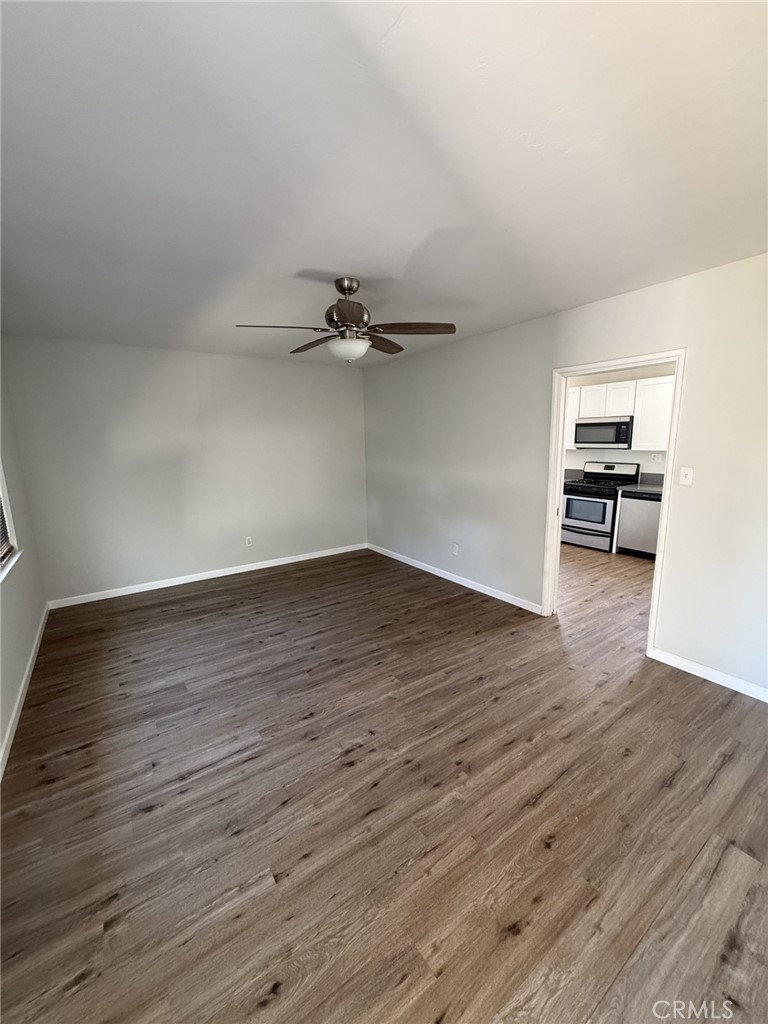 319 Elm Street Shafter, CA 93263 - Photo 10 of 14 wooden floor in an empty room