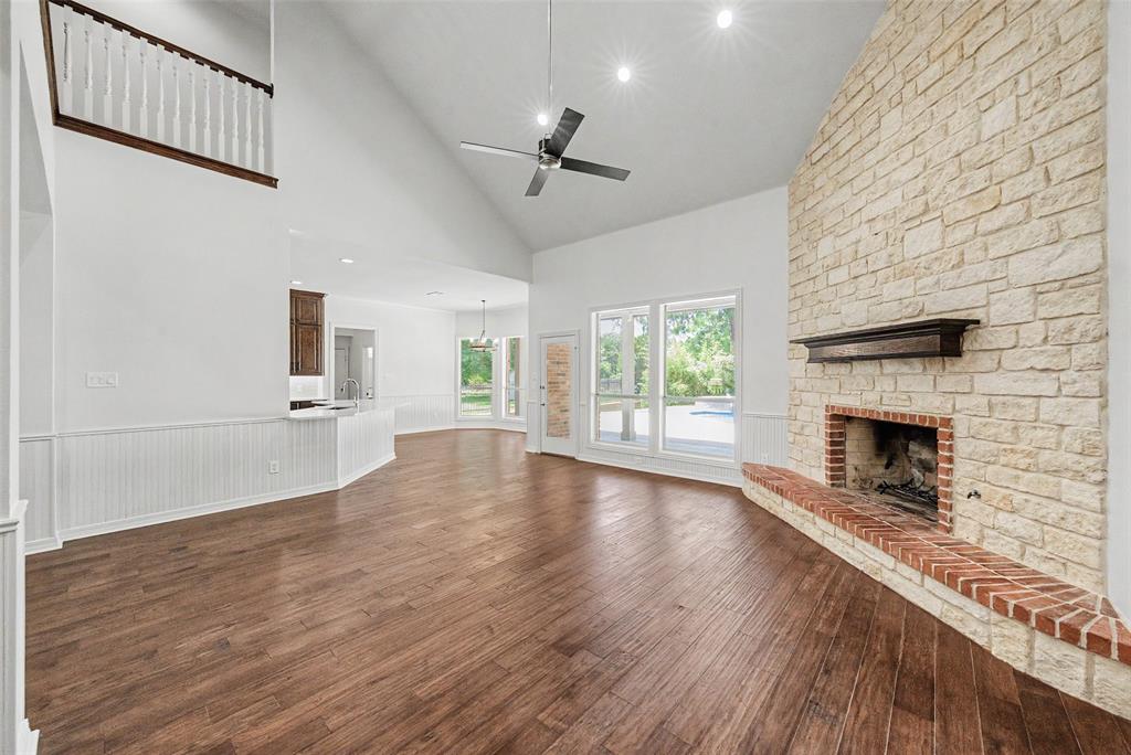 1200 Mount Gilead Road Keller, TX 76262 - Photo 16 of 38 a view of empty room with wooden floor and fireplace