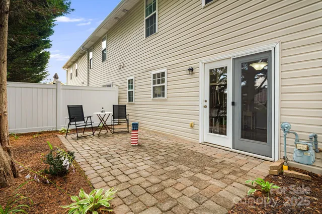 a backyard of a house with seating space