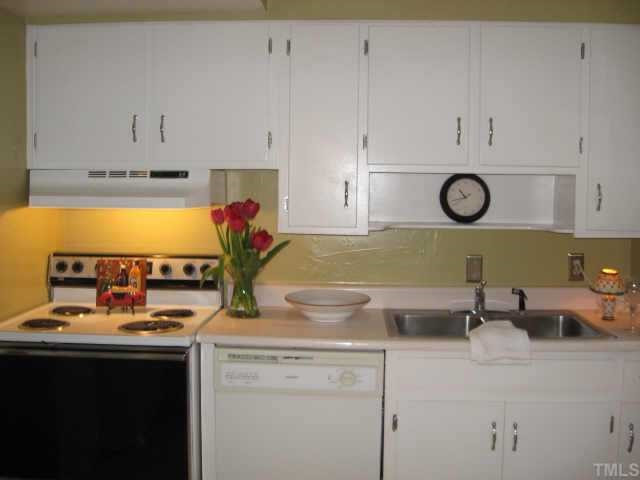 837 Bryan Street Raleigh, NC 27605 - Photo 3 of 11 Precious kitchen with fresh paint and hardware...opens to private courtyard.. Other