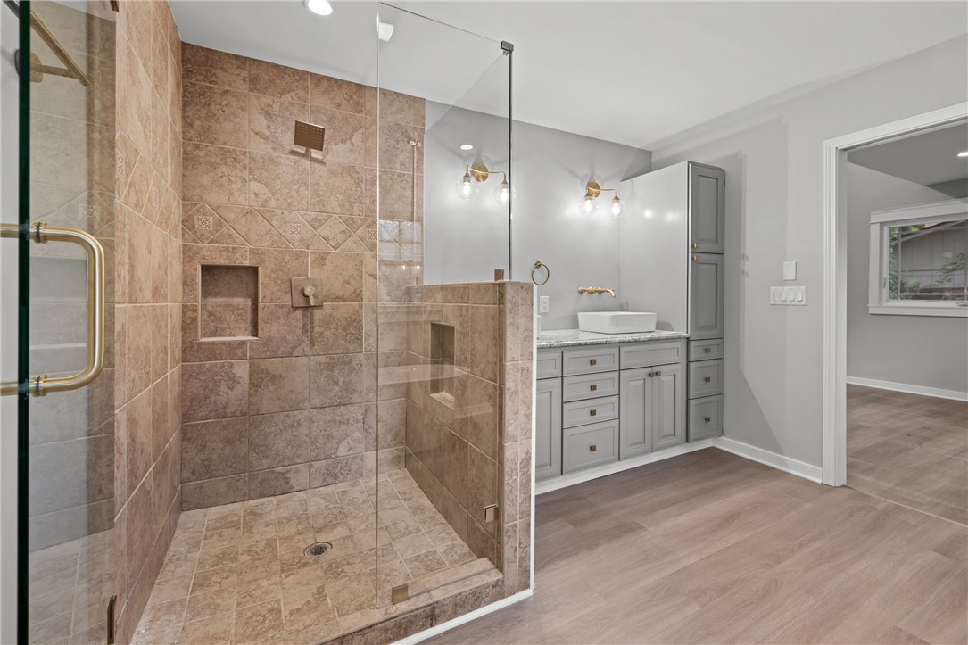 309 Woodland Way Clemson, SC 29631 - Photo 19 of 43 This primary bathroom features a spacious shower and sleek vanity, offering both style and functionality.