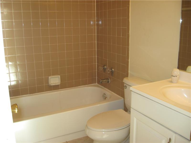 11197 Model Circle West Boca Raton, FL 33428 - Photo 13 of 23 a white bath tub sitting next to a white toilet and sink