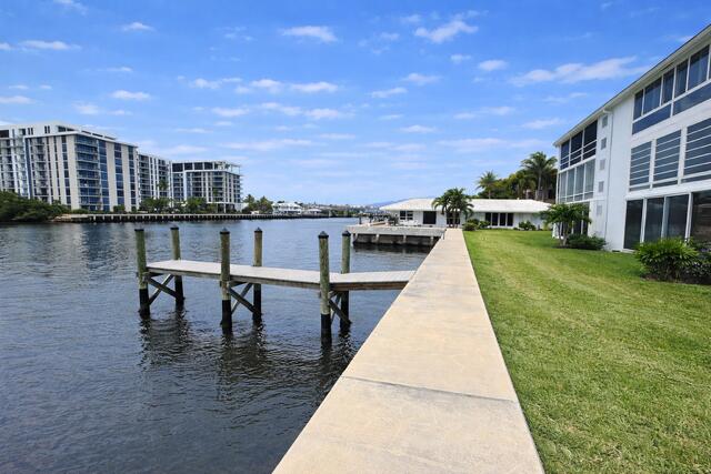 a swimming pool with outdoor seating and yard