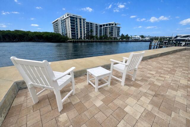5520 North Ocean Boulevard, Unit 201 Ocean Ridge, FL 33435 - Photo 2 of 17 a view of swimming pool with outdoor seating and city view