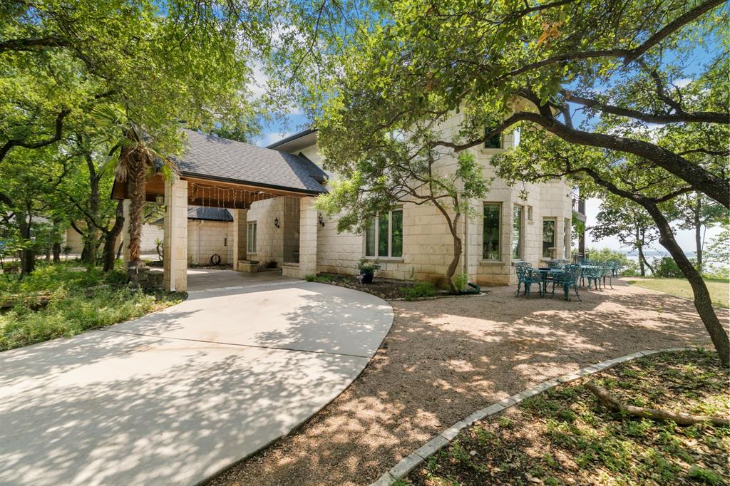 9957 Boat Club Road Fort Worth, TX 76179 - Photo 15 of 38 a front view of a house with a yard and tree