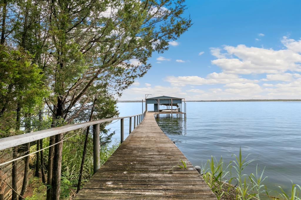 9957 Boat Club Road Fort Worth, TX 76179 - Photo 34 of 38 a view of a balcony with wooden floor and fence