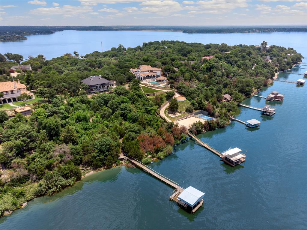 9957 Boat Club Road Fort Worth, TX 76179 - Photo 4 of 38 an aerial view of a house with a garden and lake view