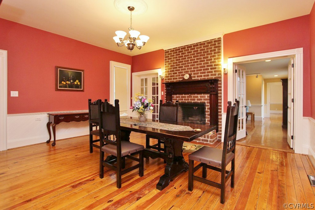 3005 Plank Road Kenbridge, VA 23944 - Photo 14 of 24 a dining room with furniture a chandelier and wooden floor