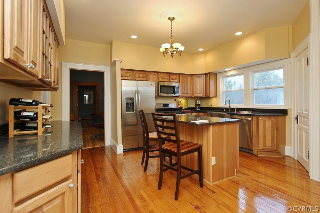 3005 Plank Road Kenbridge, VA 23944 - Photo 17 of 24 a kitchen with stainless steel appliances kitchen island granite countertop a stove a refrigerator and a microwave