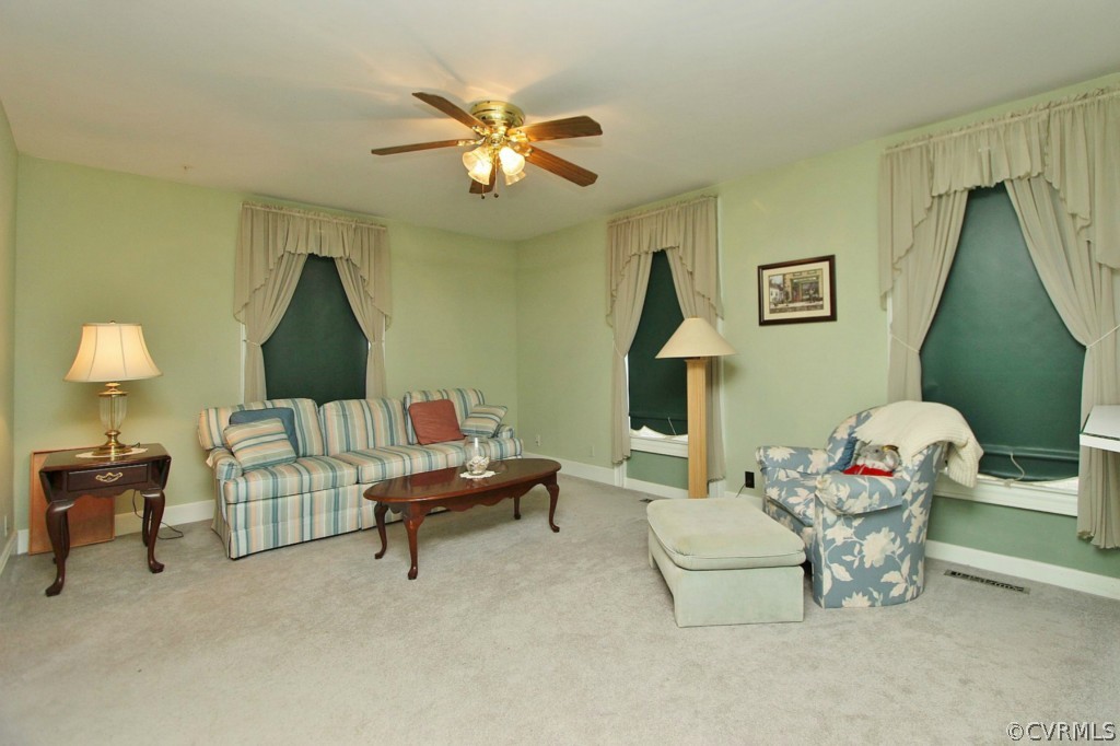 3005 Plank Road Kenbridge, VA 23944 - Photo 22 of 24 a living room with furniture and a chandelier