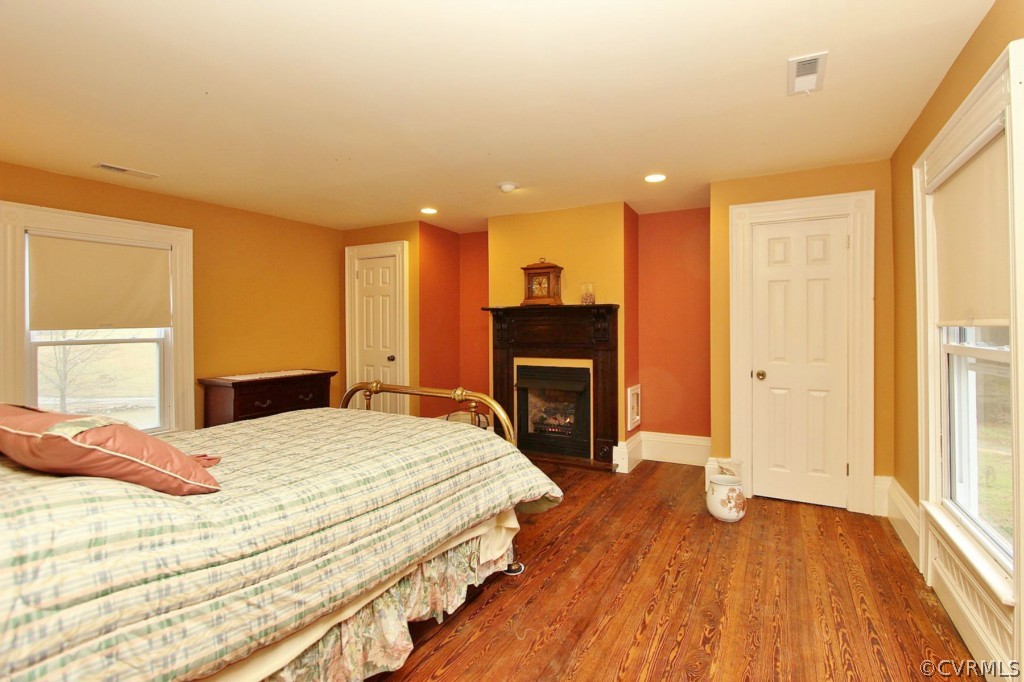 3005 Plank Road Kenbridge, VA 23944 - Photo 23 of 24 a bedroom with a bed and a fireplace