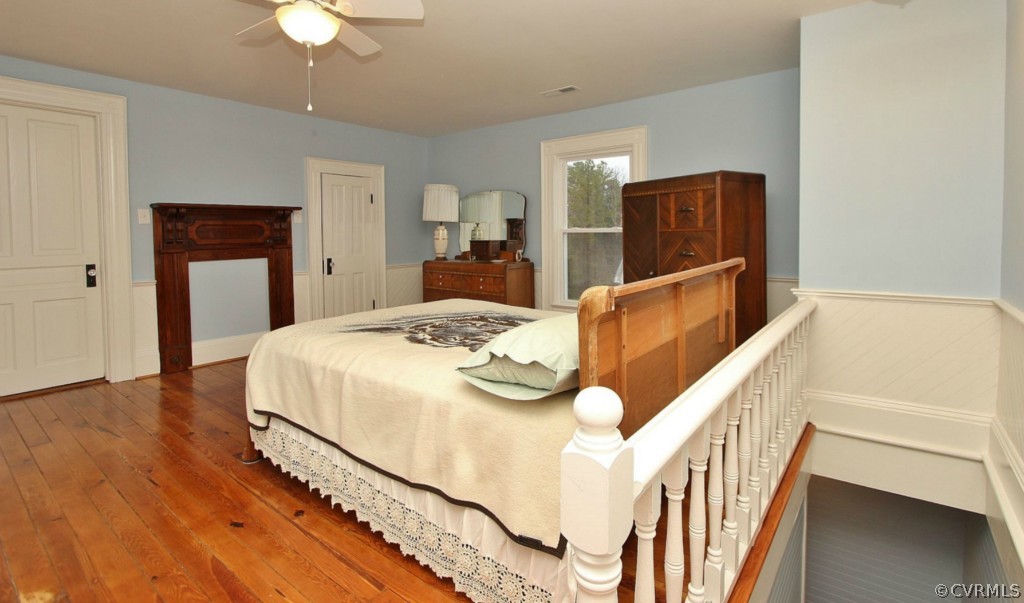 3005 Plank Road Kenbridge, VA 23944 - Photo 24 of 24 a bedroom with a bed and a chandelier
