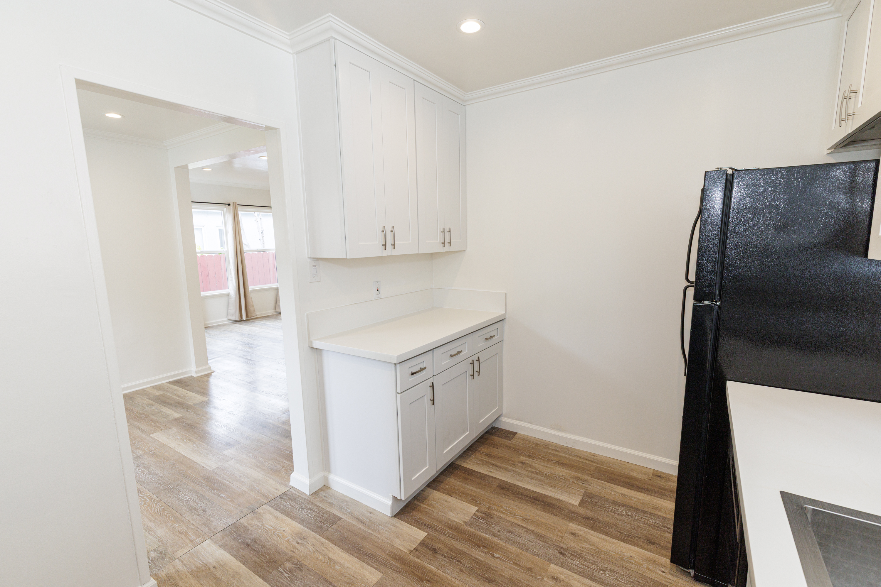 535 Washington Boulevard Venice, CA 90292 - Photo 11 of 12 a kitchen with a white cabinets and white appliances