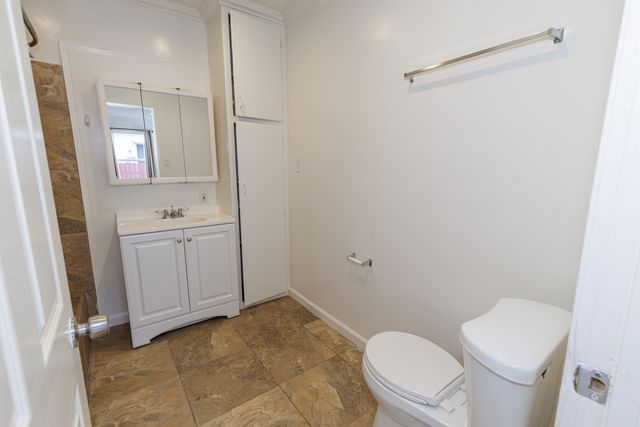 a kitchen with a white cabinets and white appliances