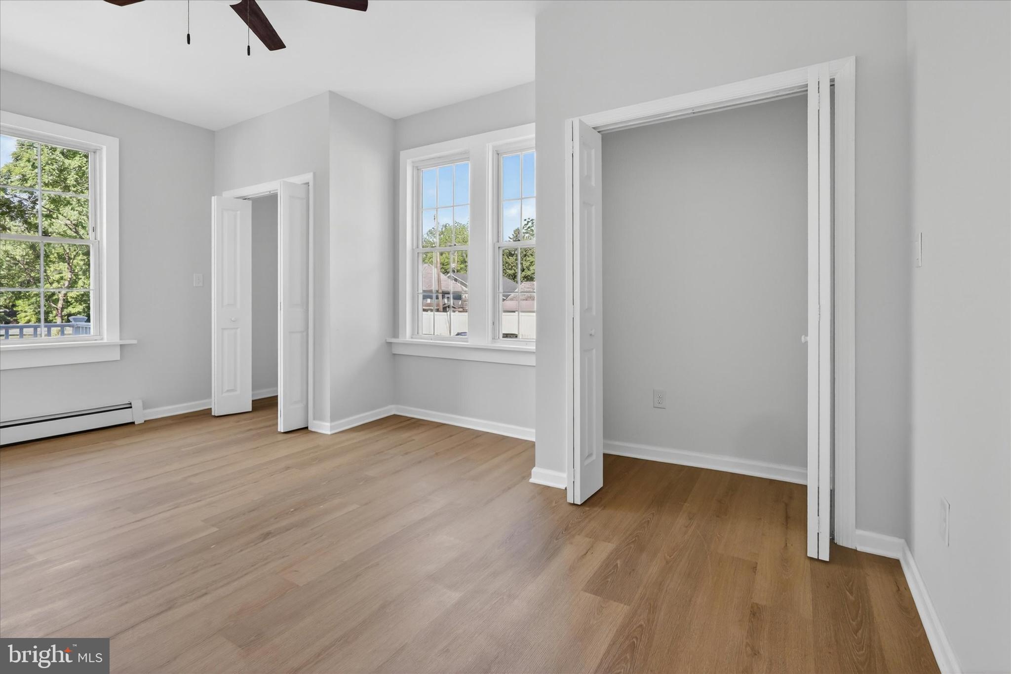 509 Lumberton Road, Unit 1 Hainesport, NJ 08036 - Photo 7 of 33 an empty room with wooden floor and windows