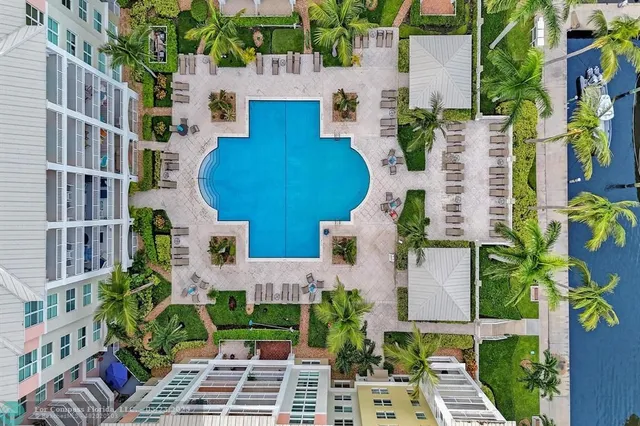 front view of a building with potted plants
