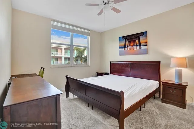 a bedroom with a bed and cabinets