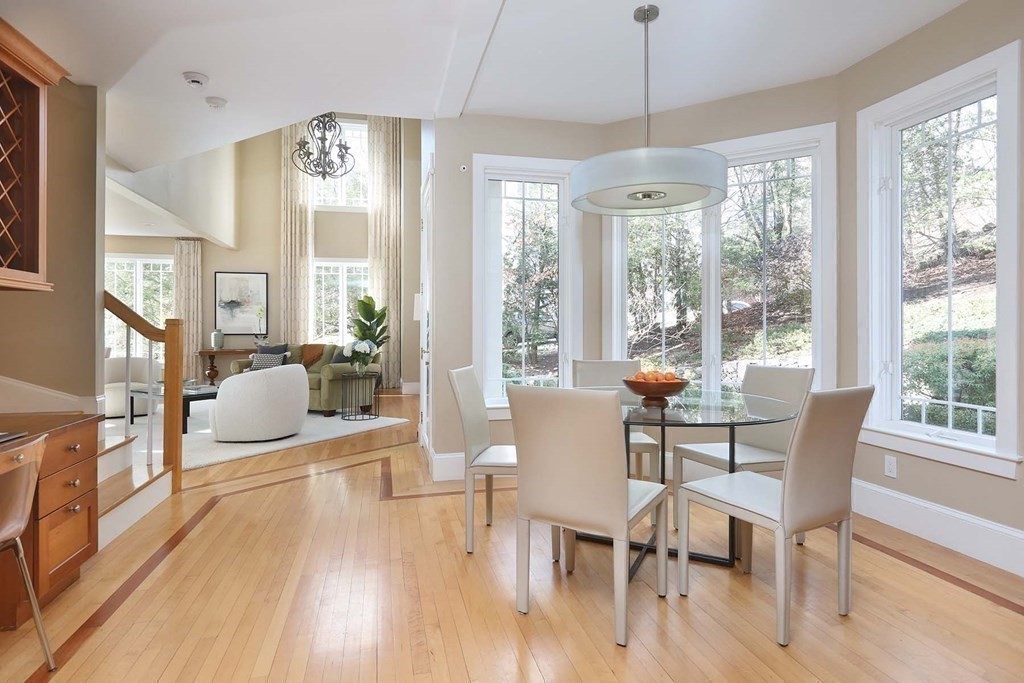 15 Laura Road Newton, MA 02468 - Photo 7 of 27 a view of a dining room with furniture large windows and wooden floor
