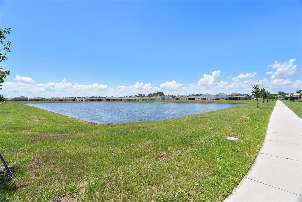 1634 Groveline Road St. Cloud, FL 34771 - Photo 35 of 43 a view of a lake with a big yard