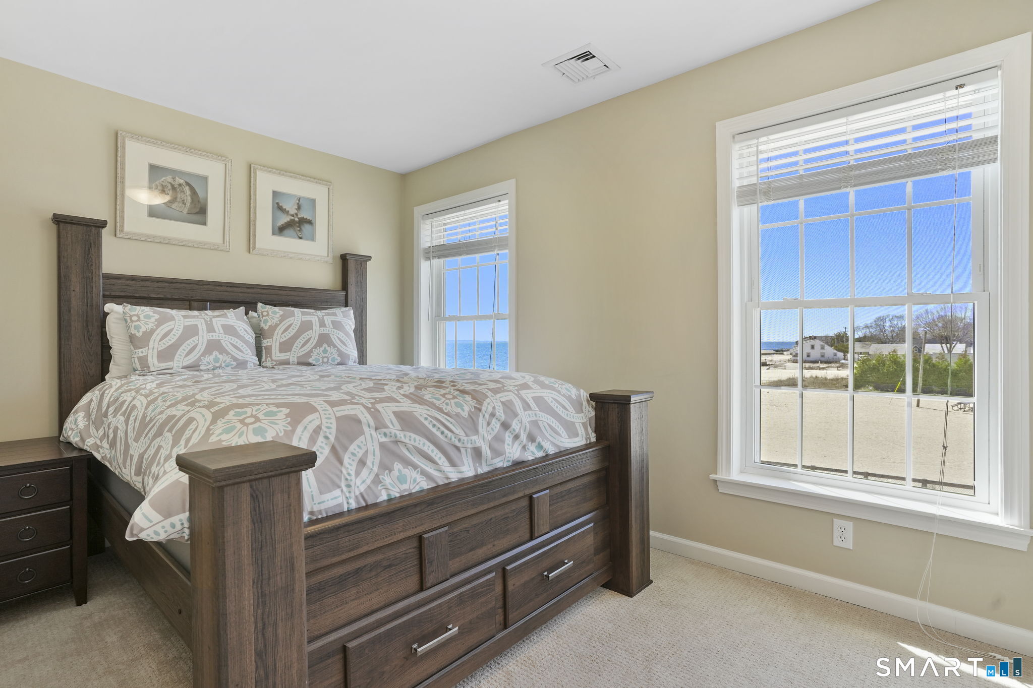 40 Pond Road Old Lyme, CT 06371 - Photo 9 of 35 a bed sitting in a bedroom next to a window