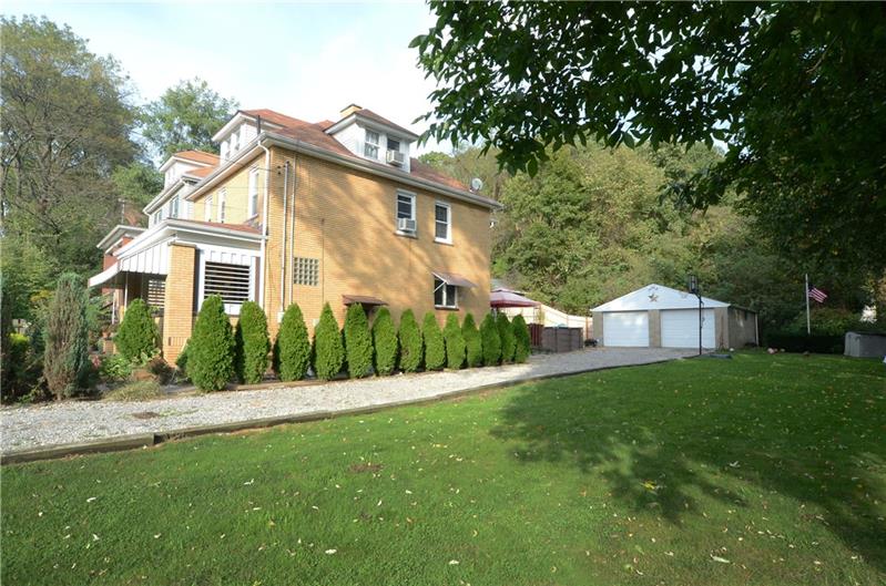 Side yard. This lovely home sits on a double lot. Great flat fenced in yard!