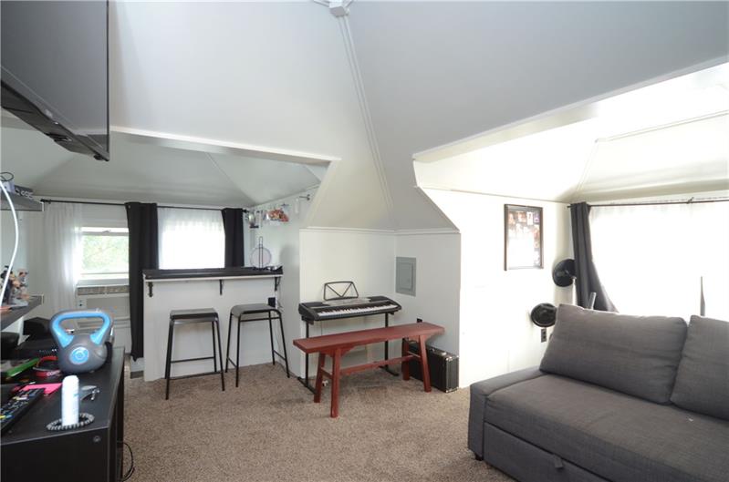 2006 Beaver Road Ambridge, PA 15003 - Photo 17 of 25 This extra house space located on the third floor is heated during the winter! Also lots of windows allow for natural light! This recently updated space with newly installed carpet makes for an ultra hip place for anyone to hangout!