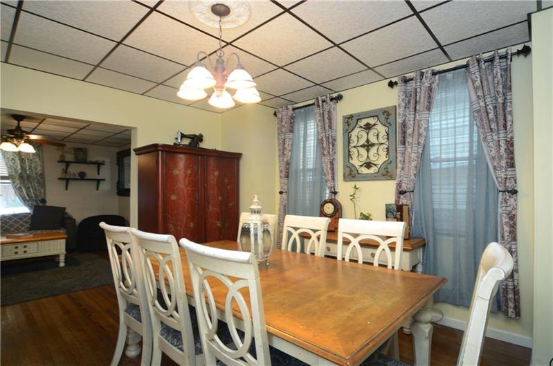 2006 Beaver Road Ambridge, PA 15003 - Photo 18 of 25 Dining room area flows naturally into living room area. The kitchen is just off the dining area, which makes a great space for charming your guests!