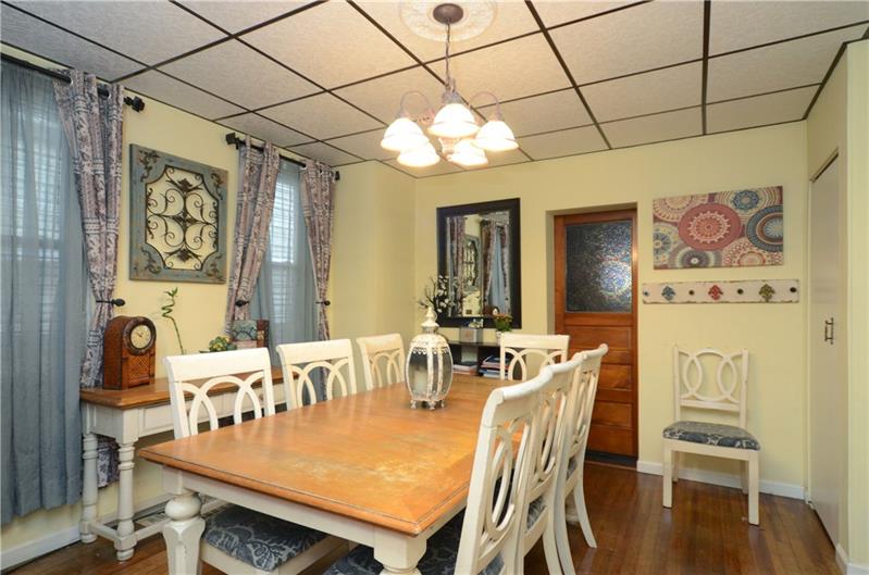 2006 Beaver Road Ambridge, PA 15003 - Photo 20 of 25 Dining room area with two large windows that allow light to encapsulate this space! Original hardwood floors bring charm and character to the dining room!