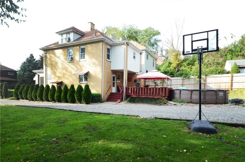 Side of home. Driveway leading to two car detached garage. 