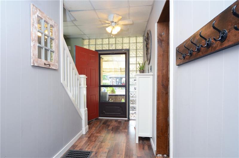 2006 Beaver Road Ambridge, PA 15003 - Photo 21 of 25 Amiable farmhouse entryway leads to the upstairs. The floor has been recently updated to bring that modern feel to the home!