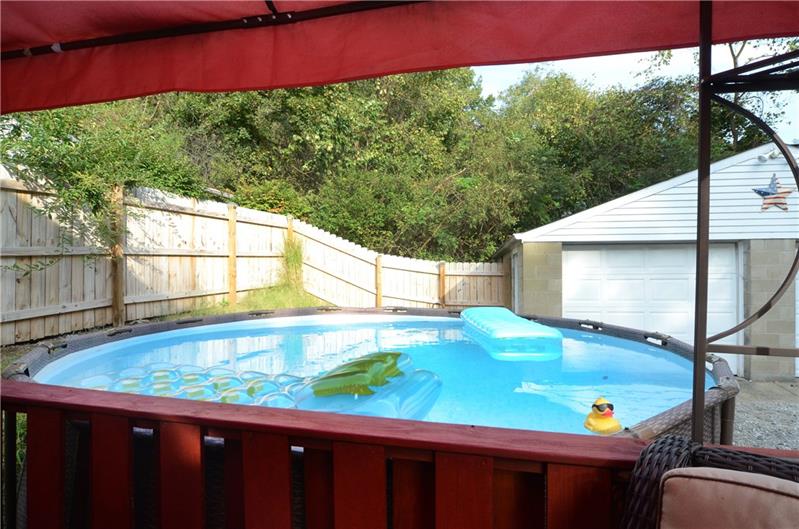 Deck overlooking swimming pool. 