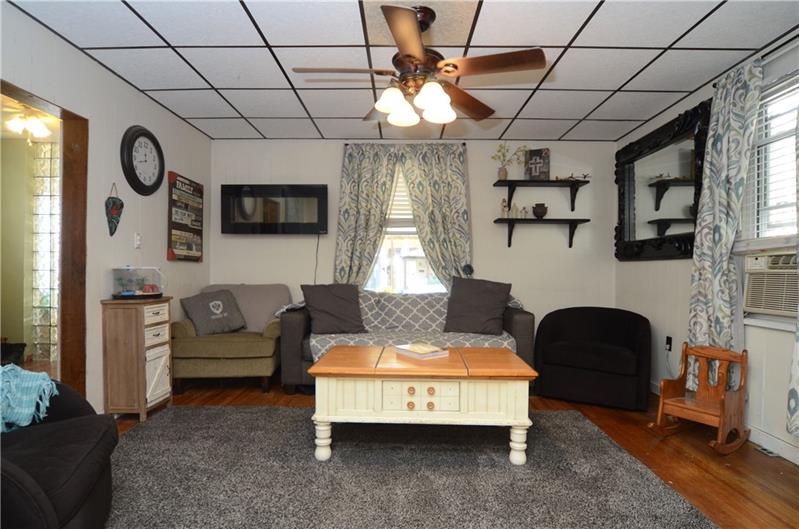 Living room open to dining room. Great neutral colors ready for you to move right in!