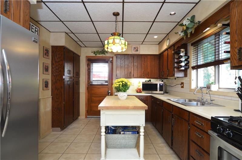 2006 Beaver Road Ambridge, PA 15003 - Photo 10 of 25 Kitchen area leads to the farmhouse entryway. Such a great flow throughout the house! This is a must see!