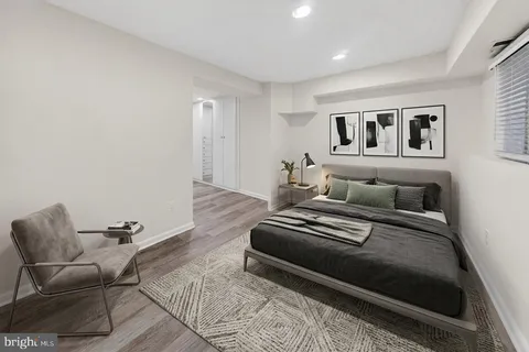 a bedroom with a bed and a couch