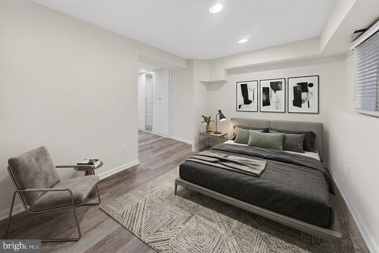 456 M Street Northwest, Unit 1 Washington, DC 20001 - Photo 12 of 19 a bedroom with a bed and a couch