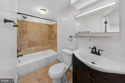 a bathroom with a sink a toilet and a bathtub